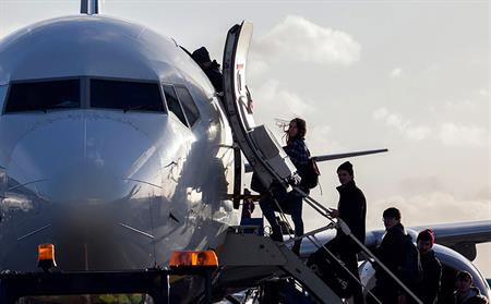 passengers boarding plane